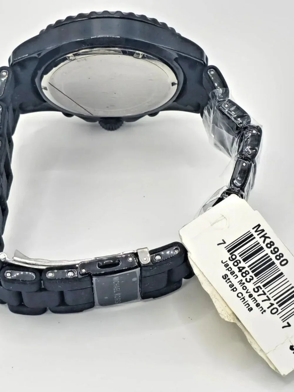 Michael Kors black papers